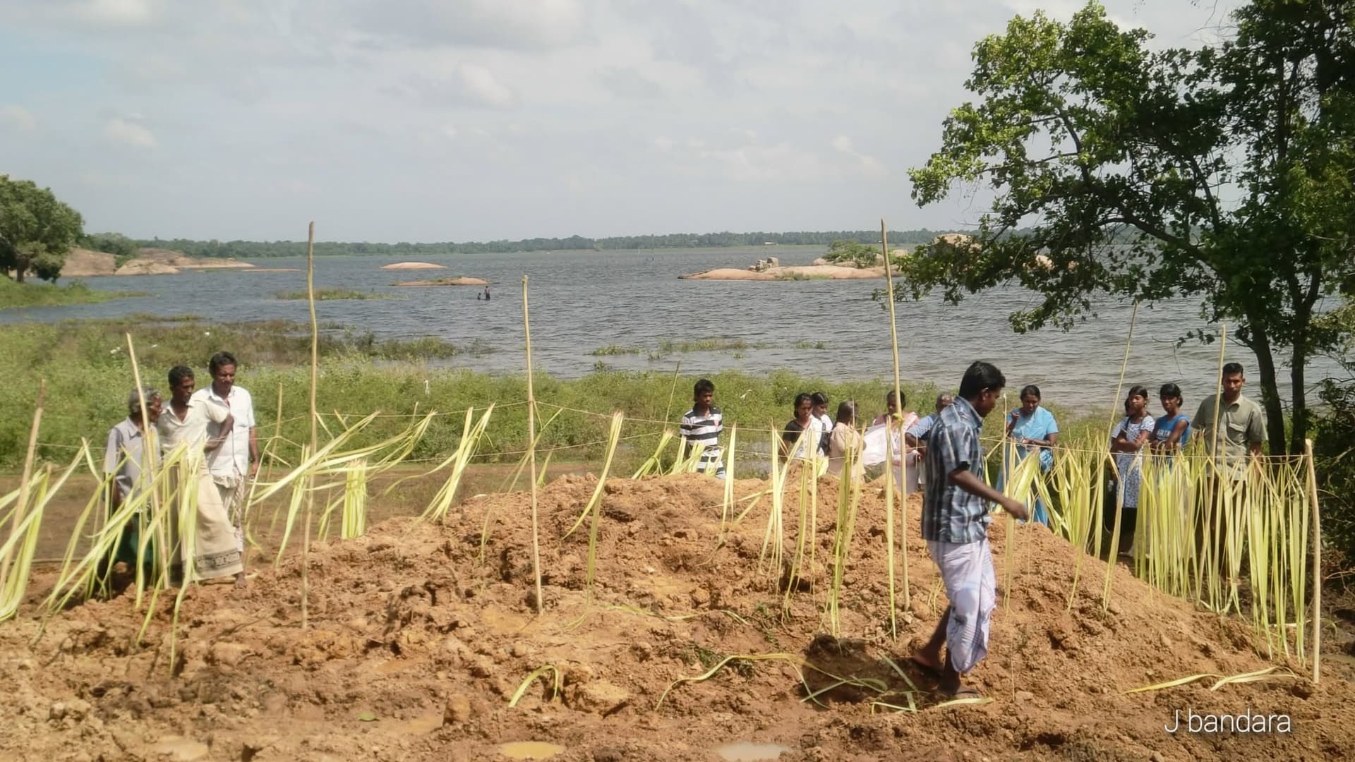 Villagers gathered around the burial site of the Siyambalangamuwa Tusker